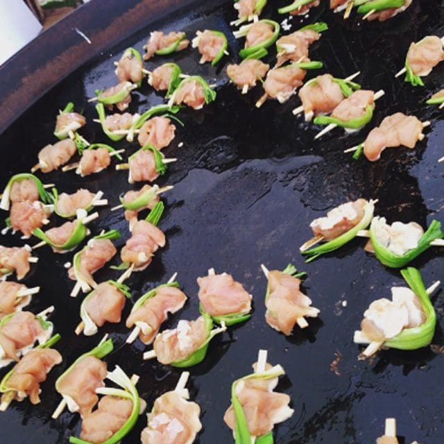 Big outdoor food, huge paella pans, Sussex wedding caterer, event catering, the image shows Souvlaki - grilled breast skewers with oregano & lemon