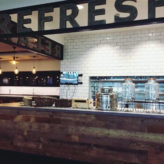 Modern Servery, Fresh Design, with REFRESH outlined on a sign above the counter.